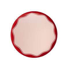 a red and white plate on a white background