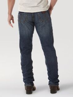 OUR WESTERN ROOTS MADE MODERN Wrangler® Retro® slim fit jeans nod to our history while introducing fits and washes suited for the modern cowboy. Designed with a closer fit and leg opening that still falls comfortably over boots, our men's Wrangler® straight leg slim fit jeans add extra style to the classic look you love. These jeans sit low on the waist and make it easy to show off your favorite belt buckle. That design detail is our Western heritage showing through, something that happens often Fitted Jeans With Five Pockets For Ranch, Rugged Fitted Jeans For Rodeo, Fitted Dark Wash Jeans For Ranch, Modern Cowboy, Straight Leg Jeans Men, Dark Wash Denim, Slim Fit Jeans, Classic Looks, Straight Leg Jeans