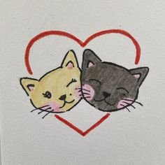 two cats face each other in front of a heart