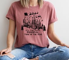 "It's The Most Magical Time Of The Year Shirt, Christmas T-shirt, Wizard T-shirt, Christmas Family Party,  Universal Studios Christmas 2024   Product * Non-Heather shirts are 4.2 oz. and 100% cotton * Heather Shirts are 4.2 oz. and 52/48 cotton/polyester * Unisex sizing * Coverstitched collar and sleeves * Heat transfer label * Machine wash warm, with like colors * Medium iron Important * Please review shirt size and color options before ordering. * If you want to order different colors (which one is not available in the options), long-sleeve shirts, sweatshirts, etc..., please contact us, and we help you. * Our most important goal is to make sure you are a happy customer that received everything you were expecting. Please give us a chance to resolve any problem by contacting us before lea Festive Crew Neck T-shirt For New Year, Graphic Print Tops For New Year Holiday, Festive Crew Neck Tops With Graphic Print, New Year's Graphic Print Crew Neck Tops, New Year Graphic Print Crew Neck Tops, Festive Graphic Print Crew Neck Tops, Casual Graphic Print Tops For New Year, Universal Studios Christmas, Christmas Family Party