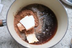 a pot filled with brown and white ingredients