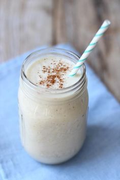 a smoothie in a mason jar with a straw