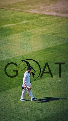 a man walking across a lush green field next to a black goat logo on the grass