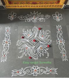 an intricate design on the ground in front of a door