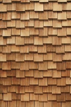 a close up view of a roof made out of wood planks and shingles