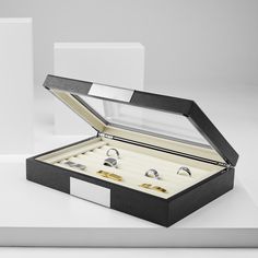 Wrangle your bling with this amazing display case. Holds up to 20 pairs of cufflinks or 25 rings in the padded interior. Features a hinged glass lid and durable exterior. Easy access and safe storage. Modern Rectangular Jewelry Storage With Box, Modern Rectangular Jewelry Storage Box Included, Modern Formal Jewelry With Box Included, Ring Case, Cufflink Box, Velvet Interiors, Welcome To The Family, Wood Polish, Jewelry For Men