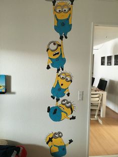 this is an image of a wall sticker in the shape of minion characters