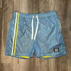 Item Is Nwt. Color Is Blue And Yellow. Material Is Cotton (50%) And Polyester (50%). Size Is A Men’s Xl (Measures 32). Inseam Measurement - 4” Total Length - 17” Rise - 13” Leg Opening - 12.5” Np516 Blue Athletic Shorts With Built-in Shorts For Summer, Blue Athletic Shorts With Elastic Waistband For Beach Season, Blue Athletic Shorts For The Beach, Blue Athletic Shorts For Beach Season, Blue Athletic Shorts For Summer Beach Season, Blue Summer Athletic Shorts For Beach Season, Blue Nylon Short Swim Trunks, Blue Beachwear Athletic Shorts For Summer, Light Blue Sports Shorts For Summer