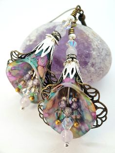 Purple Rainbow Crystal Flower Earrings ~ Victorian Earrings ~ Handmade Dangle Drop Flower Earrings, Boho Hippie Art-Nouveau Vintage Style, Unique Gift For Her. ~Victorian Chic ~ ♡ These are a beautiful pair of vintage Victorian inspired hand painted Lucite Lily flower earrings. I have painted the Lucite in the colours of the rainbows. The lightly painted lucite is wrapped in lacy Brass and Bronze filigree and findings. Which goes wonderfully with the delicate look of the Swarovski Crystals in Pa Vintage Jewelry Repurposed, Victorian Earrings, Purple Rainbow, Rainbow Flower, Earrings Handmade Dangle, Chic Earrings, Pink Rainbow, Rainbow Crystal, Amethyst Beads