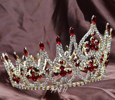 Fabulous Beauty Pageant Tiara Diadem Red Rhinestone Bridal Gold Crown Prom Party           Description:   You are looking at a gorgeous tiara crown. Sparkling clear and red genuine austrian rhinestones are set in a beautiful gold-plated setting. All rhinestones sparkle a lot and are prong set by hands! With unadjustable full band. 4 small loops at the bottom, can use hair clips to fix the crown. This crown is full of sparkle! It is perfect for wedding, pageant, prom, party or any special occasions.  Thanks for looking!   Size: Front center is approx. 4-1/4''(11cm) in Height, top is 8-1/4''(21cm) in Diameter and base is 6-3/4''(17cm) in Diameter.   Condition: Brand New Package: OOP Bag           Shipment We will send the items within 24 hours once your payment is completed, and provide trac Red And White Crown, Pageant Tiara, Quince Crowns, Quince Crown, Red And Gold Quince, Quince Stuff, Red Quince, Quinceanera Ideas, Royal Tiaras