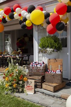 an outside area with balloons and flowers