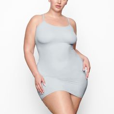 Fits Everybody Slip Dress | Sky — A buttery soft mini dress that hugs your curves. Form-fitting and lightweight, this style is perfect to wear under other dresses as second-skin lining. Stretch Mini Dress With Built-in Bra, Solid Color Bodycon Mini Dress With Built-in Bra, Seamless Bodycon Mini Dress, Mini Dress With Built-in Bra, Seamless Solid Color Bodycon Mini Dress, Fitted Mini Dress With Built-in Bra For Daywear, Solid Seamless Mini Dress, Seamless Solid Color Mini Dress, Elegant Solid Seamless Mini Dress