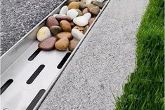 rocks are placed on the edge of a metal ramp to be used as a planter