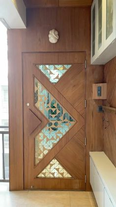 a wooden door with decorative glass inserts