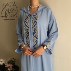 Sublime Moroccan jellaba jeblya, made in premium quality silk crepe, embroidered in Terz lmerdoukh style, and worked with trasen and Gourmette. Jellaba cut is a straight (loose) jeblya cut. Made to order. PRODUCTION TIME: 3-4 weeks. Can be made in XS, S, M, L, XL, XXL, XXXL (Please see our size guide in the images). DELIVERY TIME: 2-5 days via FedEX You can wear this magnificent Moroccan dress "jallaba" during engagement ceremonies, the day of Aid, Ramadan, but also for all occasions such as sig Arabic Dress, Moroccan Blue, Engagement Ceremony, Moroccan Dress, Family Event, Eid Al Adha, Silk Crepe, Dress Clothes For Women, Ramadan