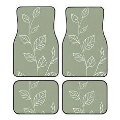 four pieces of floor mats with leaves drawn on the front and back sides, all in grey