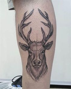 a man's leg with a deer tattoo on it