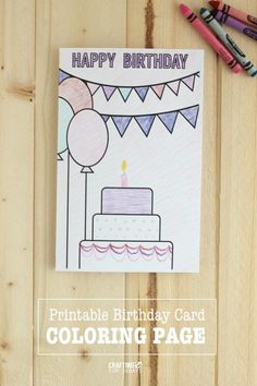 a birthday card is shown with crayons and colored pencils next to it