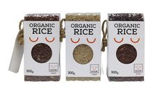 three packages of organic rice on white background