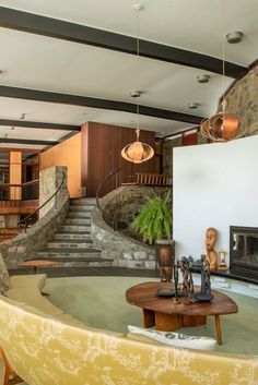 a living room filled with furniture and a fire place