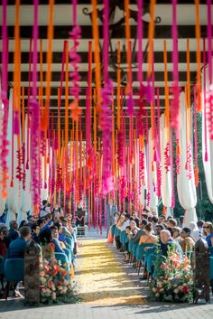 a group of people that are sitting in front of each other at a wedding ceremony