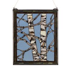 a stained glass window with trees in the center and branches on it, hanging from a rope