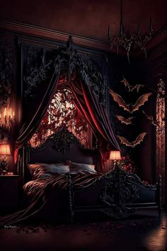 a bed with red curtains and bats hanging from it's headboard in a dark room