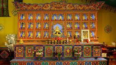 an elaborately decorated altar in a brightly colored room