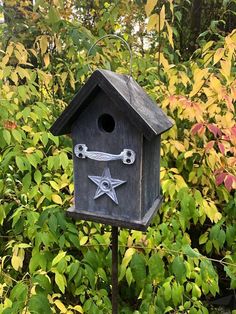 a bird house with a star on it