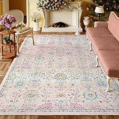 a living room filled with furniture and flowers