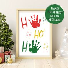 a christmas tree with presents next to it and a handprint on the wall that says make the perfect gift or keepsake