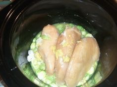 three pieces of chicken are in the crock pot