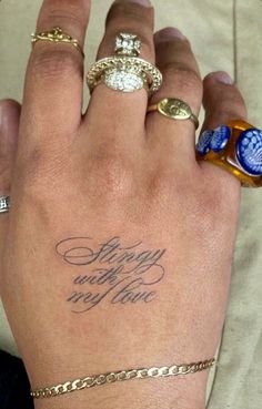 a woman's hand with three different rings on it and the words, happy whatever new you can written in cursive writing