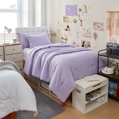 a bed room with a neatly made bed next to a window and a book shelf