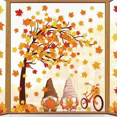 an autumn scene with two gnomes and a bicycle in front of a tree filled with leaves