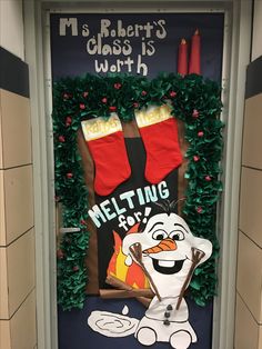 a door decorated with christmas stockings and melting hot chocolate