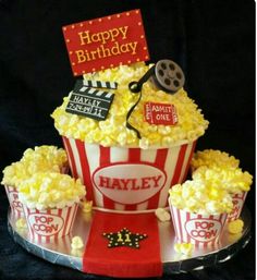 a birthday cake made to look like popcorn buckets