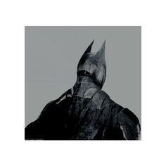 a black and white photo of a batman statue in front of a gray sky background