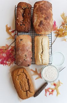 four different types of bread on a cooling rack