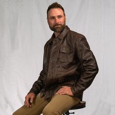 Inspired by the old west ranchers who made their mark at the base of the Bighorns… the Sheridan Barn Coat delivers enduring quality worthy of the pioneers of the past, tailored with a modern fit for the present. Outfitted with 100% full-grain lambskin leather, the Sheridan is secured by a top-to-bottom zipper concealed beneath distressed antique brass buttons, shielding an easy-clean lining that offers ample comfort and utility from sunup to sundown. Twin button-flap pockets at the side and one Waxed Canvas Jacket, Dark Brown Leather Jacket, Heavy Clothing, Barn Coat, Barn Jacket, The Old West, Brass Buttons, Leather Jacket Style, Lambskin Leather Jacket