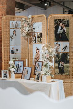 a table with pictures and flowers on it