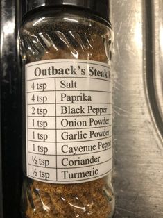 a jar filled with spices sitting on top of a counter