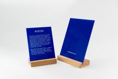 a blue book stand with a poem on it's front and back sides, against a white background