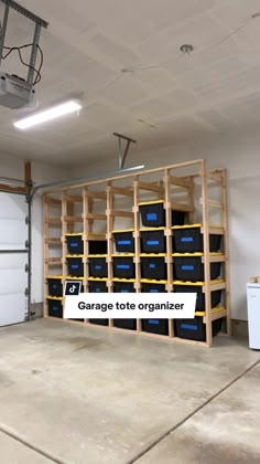 the garage tote organizer is organized with blue bins