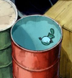 two buckets sitting next to each other on top of a wooden table with an animal drawn on the lid