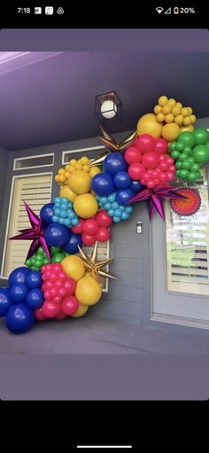 the letter f is made out of balloons and starbursts in front of a door