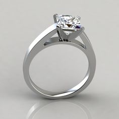 a white gold ring with a diamond on it