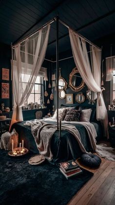 a bedroom with black walls and white drapes on the ceiling, an old fashioned bed frame