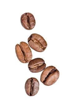 coffee beans falling down into the air