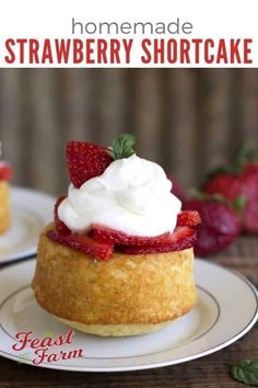 homemade strawberry shortcakes with whipped cream on top and strawberries in the background